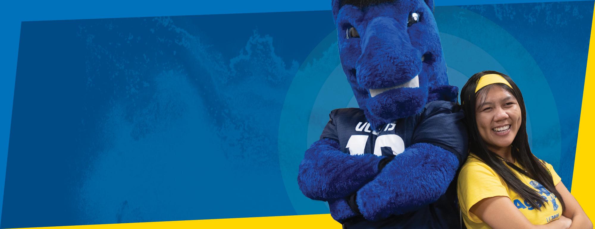 UC Davis Aggie mascot with student celebrating Aggie Day