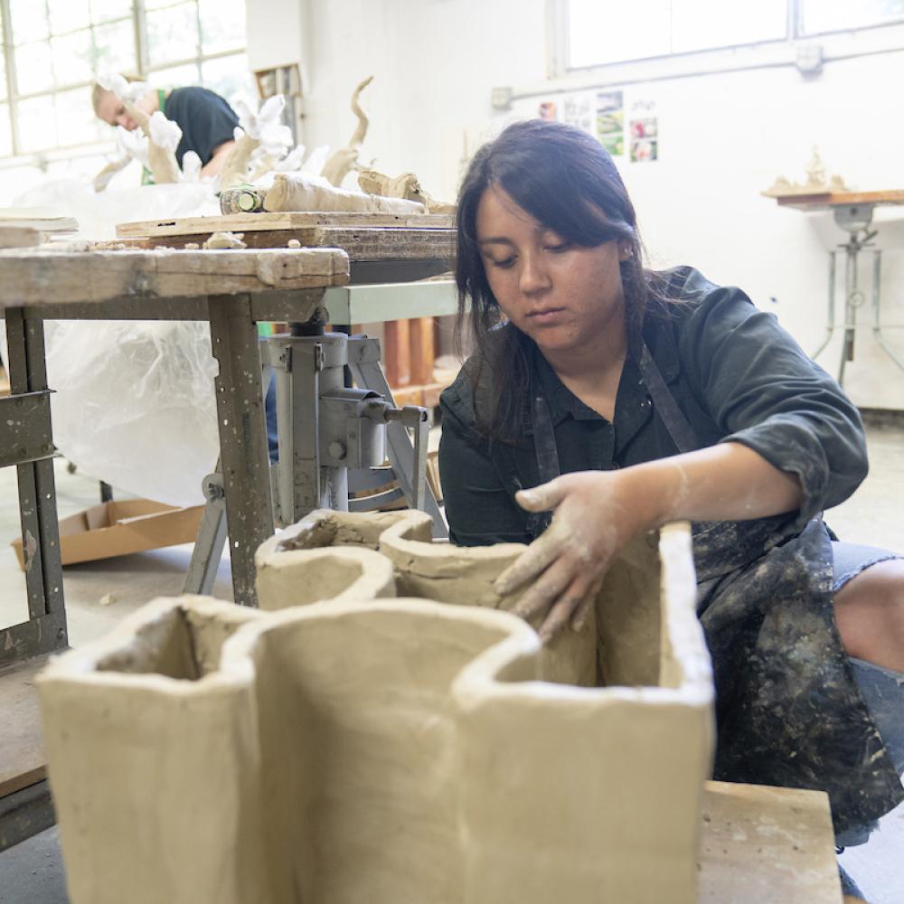 UC Davis student in ceramics class